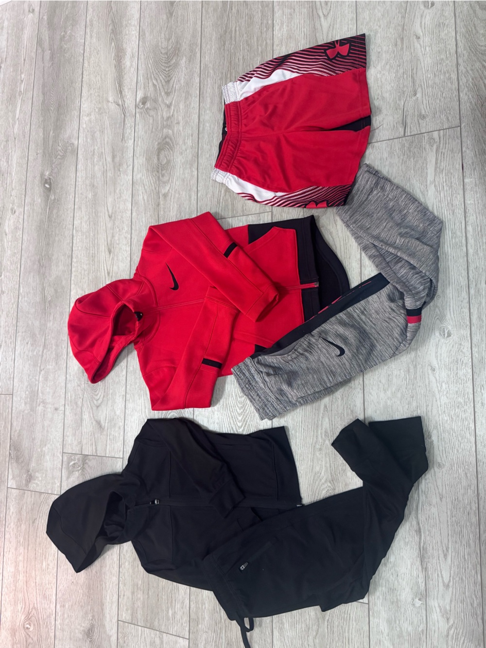 Lot of boys XS clothing:  Nike elite sweatsuit, UA shorts, generic sweatsuit